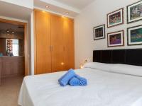 A bed or beds in a room at Apartment Aquaria-3 by Interhome