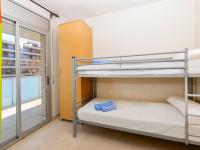 A bed or beds in a room at Apartment Aquaria-3 by Interhome