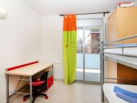 A bed or beds in a room at Apartment Aquaria-3 by Interhome