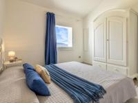 Łóżko lub łóżka w pokoju w obiekcie Villa Chicca by Interhome
