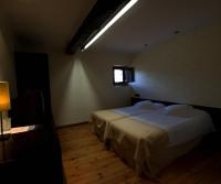 A bed or beds in a room at Hotel Boutique El Convento de Mave