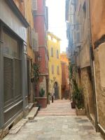 an alley in an old town with buildings at Coquet Studio Cœur de Grasse in Grasse