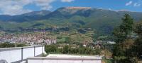a view of a city in the mountains at Villa SHAMS in Travnik