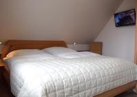 Postel nebo postele na pokoji v ubytování Haus Triton