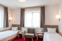 A bed or beds in a room at Gästehaus Brugger