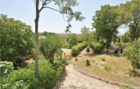 a path through a garden with trees and bushes at Amazing Home In Barjac With 3 Bedrooms, Wifi And Outdoor Swimming Pool in Barjac