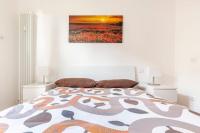 A bed or beds in a room at Bright Terrace in Milano