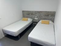 A bed or beds in a room at Agi Solimar Atico
