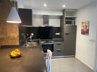 A kitchen or kitchenette at Agi Solimar Atico