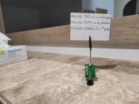 a small green object on a counter with a sign at maison luxe cléo aeroport tillé 4 a 5 personnes in Tillé
