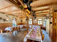 a dining room with white tables and chairs at Ölmühle Eberstedt in Eberstedt