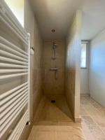 a bathroom with a shower and a walk in shower at Domaine Clos Carron Studio 2 personnes L&#39;Olivier in Saint-Amour-Bellevue