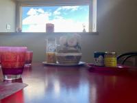 a table with a plate of food and glasses on it at Domaine Clos Carron Studio 2 personnes L&#39;Olivier in Saint-Amour-Bellevue