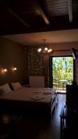 Łóżko lub łóżka w pokoju w obiekcie Guesthouse Kastania Korakis