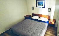 Een bed of bedden in een kamer bij R&eacute;sidence GOELIA Sun City