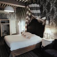 a bedroom with a large bed with a american flag on the wall at Hôtel de Paris in Besançon