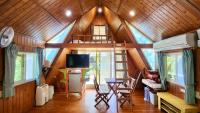 a room with a tree house with a loft at Kitefarm in Dongshan