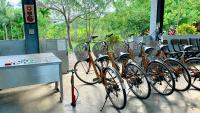 a group of bikes parked in a row next to a table at Kitefarm in Dongshan
