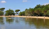 a group of people in the water at a beach at Villa du Cabestan in Andernos-les-Bains