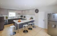a kitchen with a white counter and a refrigerator at Beautiful Home In Sauveterre With Private Swimming Pool, Can Be Inside Or Outside in Sauveterre