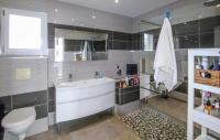 a bathroom with a tub and a toilet and a sink at Beautiful Home In Sauveterre With Private Swimming Pool, Can Be Inside Or Outside in Sauveterre