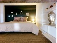 a bedroom with a large bed with a headboard at À deux pas du port de la Ciotat appart 4 pers. in La Ciotat