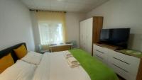 Posteľ alebo postele v izbe v ubytovaní Apartment Zsa Zsa Zenta 1