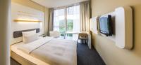 Ein Bett oder Betten in einem Zimmer der Unterkunft Lufthansa Seeheim - More than a Conference Hotel