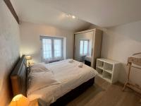 a bedroom with a large white bed and a mirror at Le 46 Magenta - Grand Duplex en hypercentre in Poitiers