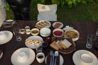 a table with a bunch of food on it at Burhan Wilderness Camps in Bhurkīā