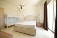 Postel nebo postele na pokoji v ubytování Villa Miramare