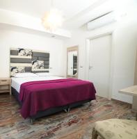 Postel nebo postele na pokoji v ubytování Villa Miramare