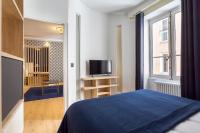 Una cama o camas en una habitaci&oacute;n de Hamac Suites - Lyon le Bellecour