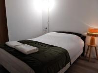 Ein Bett oder Betten in einem Zimmer der Unterkunft G&icirc;te-appartement RDC La Ville au Monnier