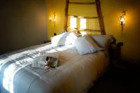 A bed or beds in a room at Locanda degli Ultimi