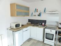 Kuchyňa alebo kuchynka v ubytovaní LA PETITE MAISON TAHET, 2 pers avec terrasse