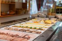 a buffet line with many different types of food at Seehotel Urban in Bodensdorf
