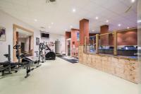 a fitness room with a gym with tread machines at Résidence Les Temples du Soleil - maeva Home - 2 Pièces 5 Personnes Sélect 52 in Val Thorens