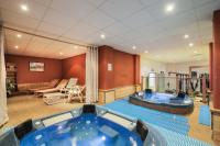 a large room with a hot tub in a gym at Résidence Les Temples du Soleil - maeva Home - 2 Pièces 5 Personnes Sélect 52 in Val Thorens