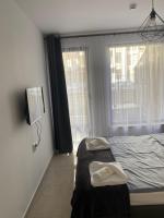Postel nebo postele na pokoji v ubytování Polarstar Delux Apartment Nr 114 am Meer