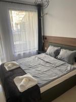 Postel nebo postele na pokoji v ubytování Polarstar Delux Apartment Nr 114 am Meer