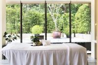 a white table in a room with a large window at The Gaia Hotel - Taipei in Taipei