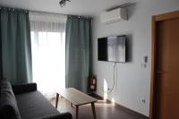 TV a/nebo společenská místnost v ubytování S215 Apartamento Las Dunas Oliva Nova