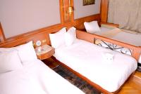 A bed or beds in a room at Nile Cruise Luxor Aswan 3,4 and 7 nights