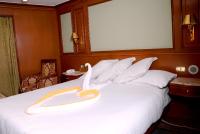 A bed or beds in a room at Nile Cruise Luxor Aswan 3,4 and 7 nights