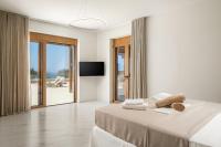 Postel nebo postele na pokoji v ubytování Delfini Villas 1, 2, 3, 4, 5, 6 - Kalamaki