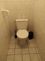 a bathroom with a toilet with two rolls of toilet paper at Confortable appart 5 mins centre de valenciennes in Anzin