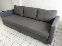 a gray couch sitting in a living room at Confortable appart 5 mins centre de valenciennes in Anzin