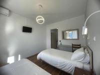Postel nebo postele na pokoji v ubytování Hotel Anthousa