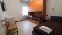 A bed or beds in a room at Pitagora
